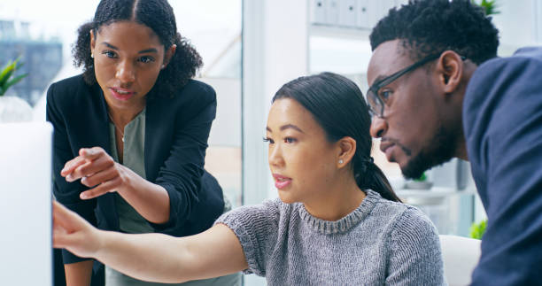 istock Business people, computer and pointing for discussion, training and mentorship with b2b planning. Diversity, meeting and collaboration for growth, future project and investment for company and goals 2184371317