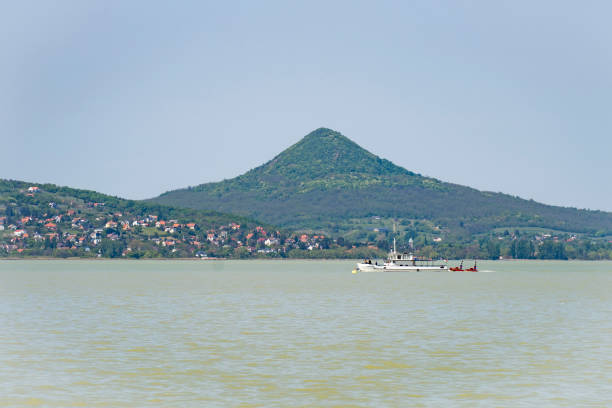 Ship on Lake Balaton in spring sunshine with mountains in the background