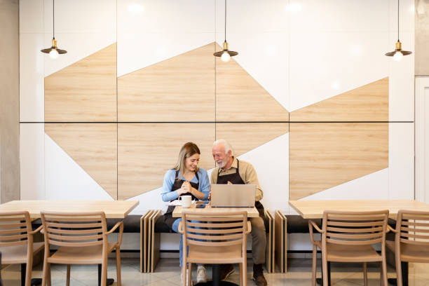 istock Two business people having an argument at coffee shop 2184373511