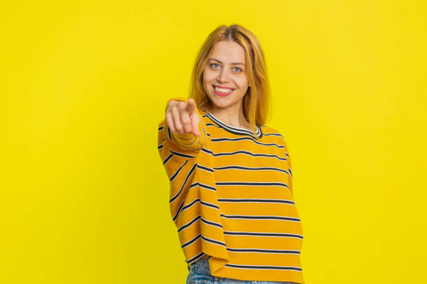 istock Smiling happy woman pointing forward to camera, choosing lucky victory winner, indicating, promotion 2184373567