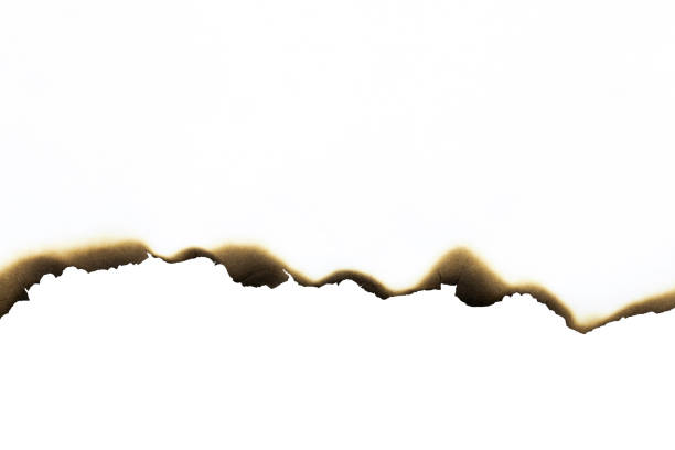 istock White paper burned edges isolated on white background with clipping path. 2184373875