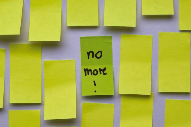 istock No more!; Concept with sticky notes with handwritten inscription 2184376712