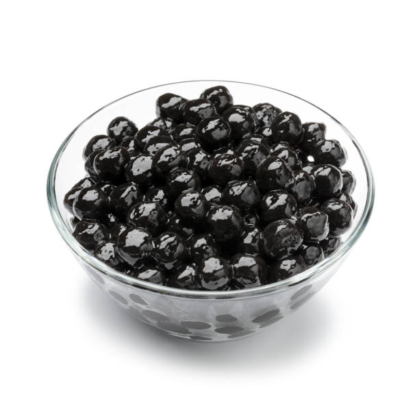 istock Bowl with cooked black tapioca pearls close up isolated on white background 2184378217