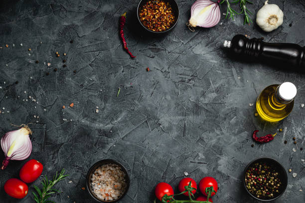 istock Black stone cooking background. Spices and vegetables. Top view. Free space for your text. 2184381418