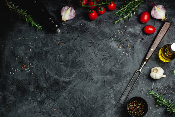 istock Black stone cooking background. Spices and vegetables. Top view. Free space for your text. 2184381419