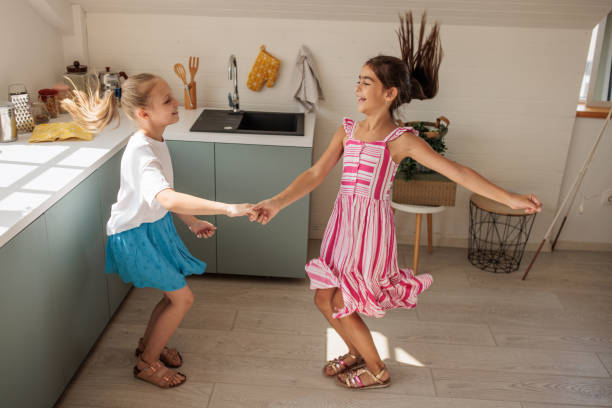istock Happy girls dancing 2184385216