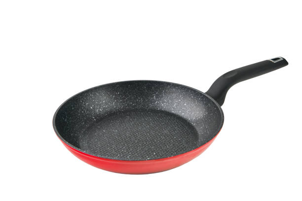 istock Red Flying black pan isolated with clipping path on white background. Clous up. High resolution image. Can be used for self design. 2184385327