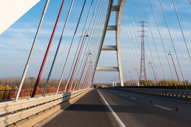 istock Perspective view of the Pentele Bridge with red lamp posts 2184391403