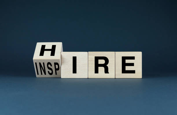 istock Wooden blocks spell out Hire and Inspire 2184391713