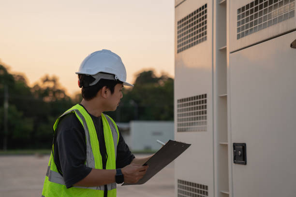 istock Electrical engineer carefully checks the power distribution cabinet, looking over the connections and parts. 2184396233