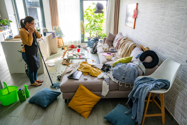 istock Upset housewife contempling her messy and dirty home interior 2184396979