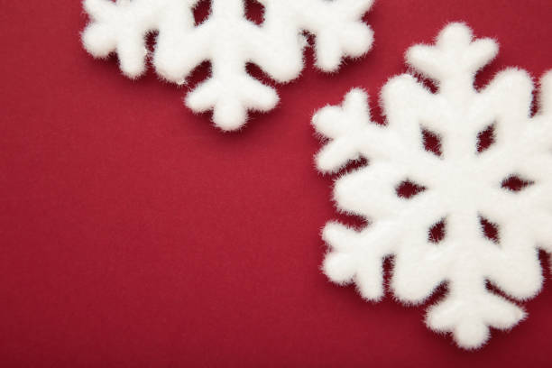 istock Beautiful snowflakes on red background. Space for text 2184397236