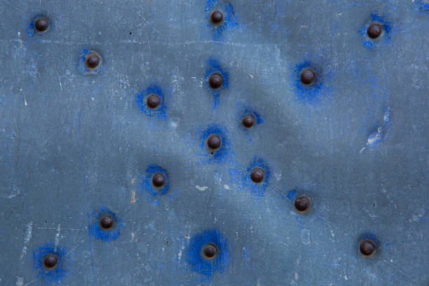 istock Texture of metal door with nails in line patterns 2184400203