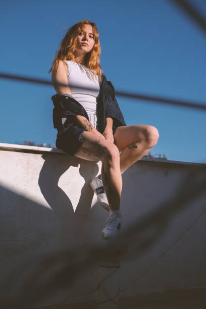 istock Cool Young Blonde Woman on a Rooftop 2184400356