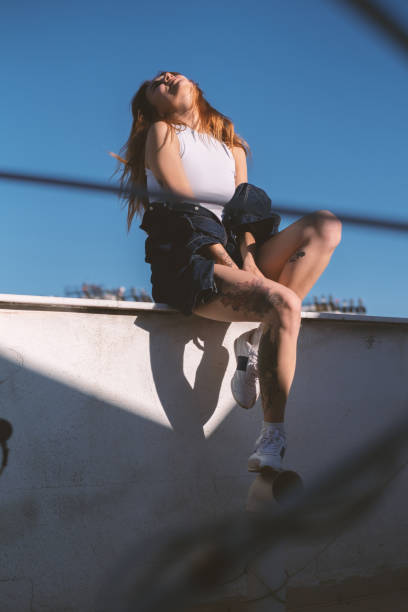 istock Cool Young Blonde Woman on a Rooftop 2184400441