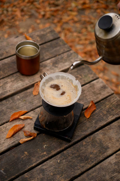 brewing coffee in nature. Autumn themed.