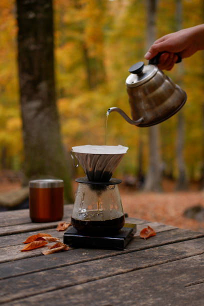 istock brewing coffee in nature. Autumn themed. 2184400582