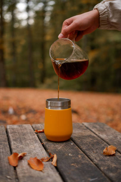 brewing coffee in nature. Autumn themed.