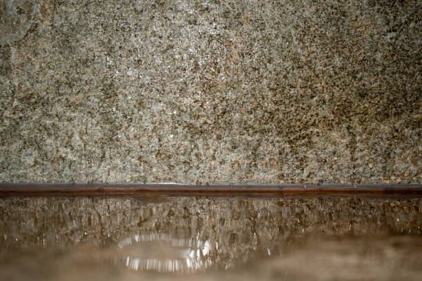 Stone background texture for mockup with copy space. Empty space natural background. Water on stone.