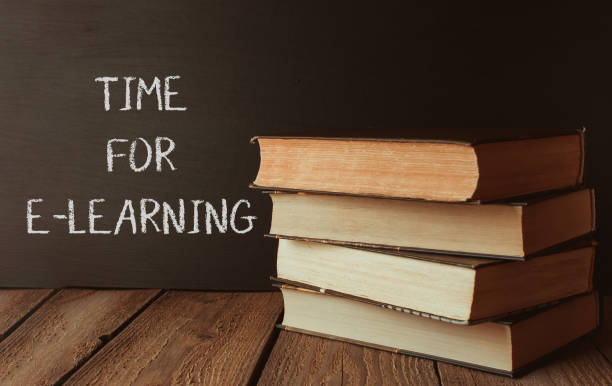 istock Stack of books with the words Time for e-learning written on a chalkboard 2184402707