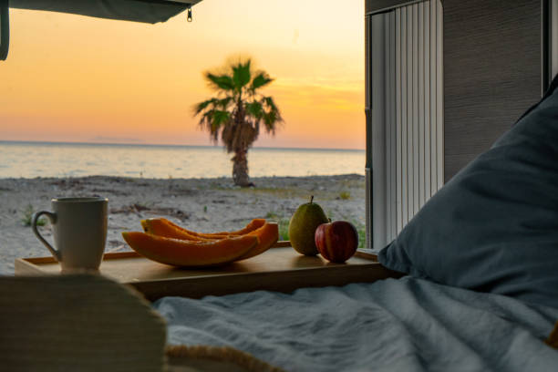 istock Sunset Sea View from Cozy Camper Van Interior 2184404134