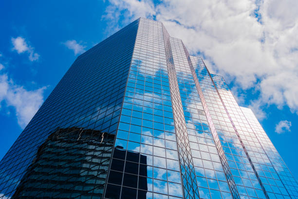 istock Skyscraper in metropolis city. City downtown with skyscraper in perspective. Perspective view. Skyscraper building architecture. Skyscraper with glassy facade. Modern city perspective. Reflecting sky 2184404500