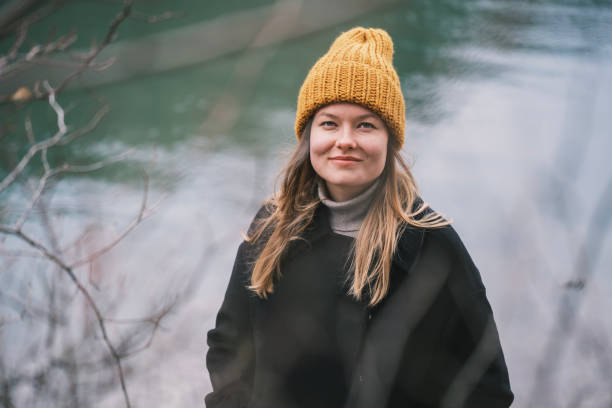 istock CHeerful young woman at the lakeside 2184405596