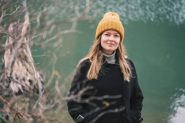 istock CHeerful young woman at the lakeside 2184405626