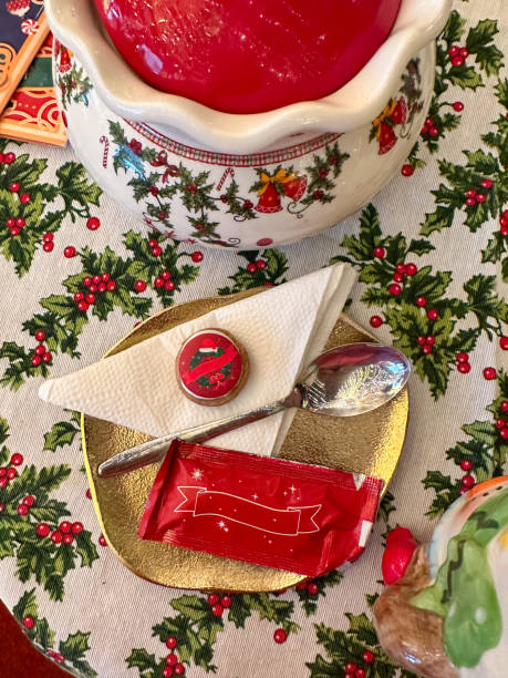 Festive dessert table with holiday-themed decorations. a warm crumble topped with a scoop of ice cream and a Christmas tree decoration captures the cozy atmosphere of a winter celebration. Festive and joyful winter celebrations. Xmas treats