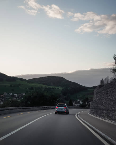 Silver VW doing on a curvy rural roads. Canton of Solothurn. Switzerland - September 23 2019.