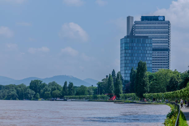 Bonn, Germany - May 21, 2024 : View of the United Nations building and the promenade next to the river Rhine in Bonn Germany