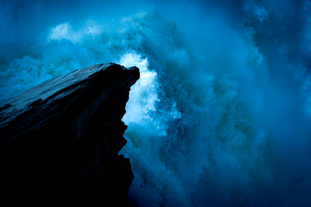 Creative picture. Waterfall and a rock in the water. The waterfall is Tännforsen which is the largest waterfall in Sweden. The Tännforsen Waterfall is part of the Indalsälven river. The picture was taken in July 2023.