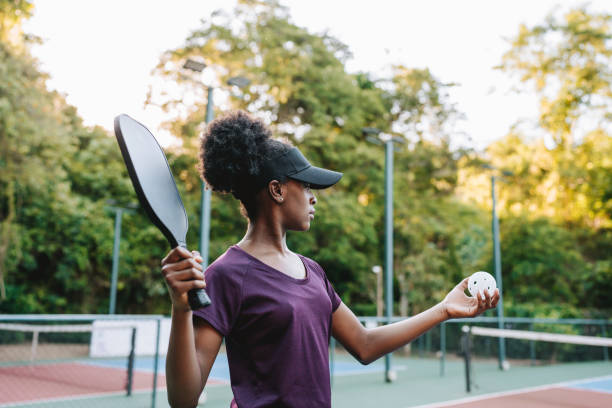istock Portrait Girl playing pickleball serving 2184412495