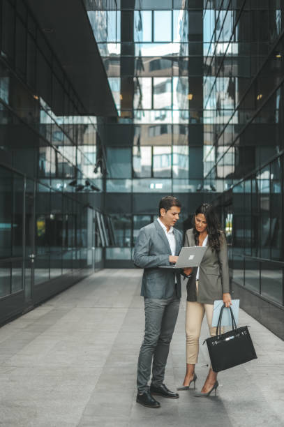 istock Business People Collaborating Outside Modern Office Building 2184417550