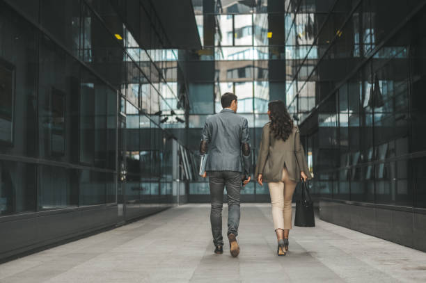istock Business Professionals Walking in Modern Urban Setting 2184417553
