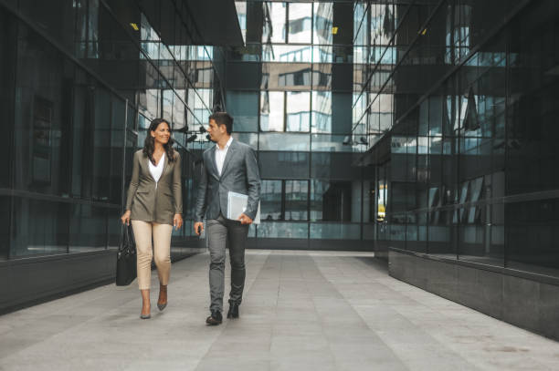 istock Professional Business Colleagues Walking Outside Office Building 2184417559