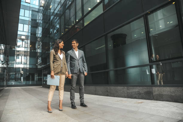 istock Business Colleagues Walking Outdoors 2184417588