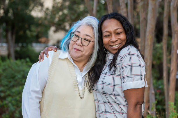 istock Two older female best friends smiling at the camera 2184423577