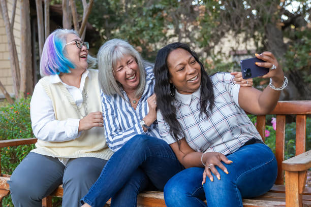 istock Three older best friends taking selfies 2184423648