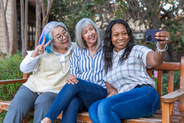 istock Three older best friends taking selfies 2184424844