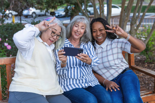 istock Three older best friends taking selfies 2184424845