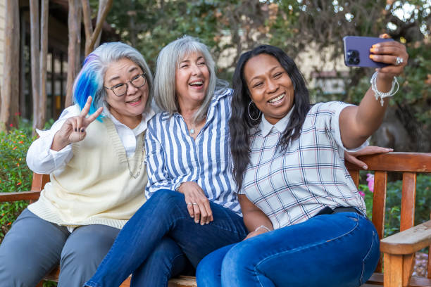 istock Three older best friends taking selfies 2184424865