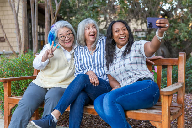 istock Three older best friends taking selfies 2184424878