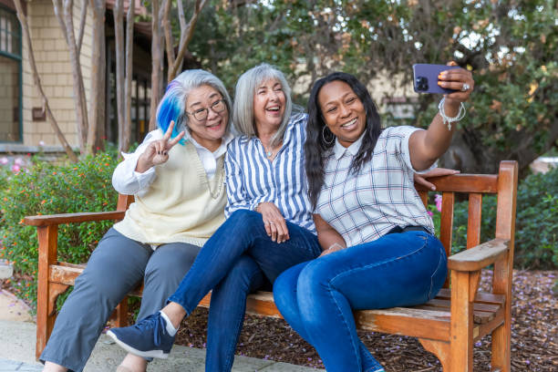 istock Three older best friends taking selfies 2184424881