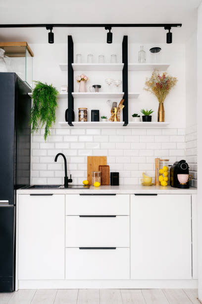 istock Modern kitchen design featuring white cabinetry and minimalist decor 2184428489