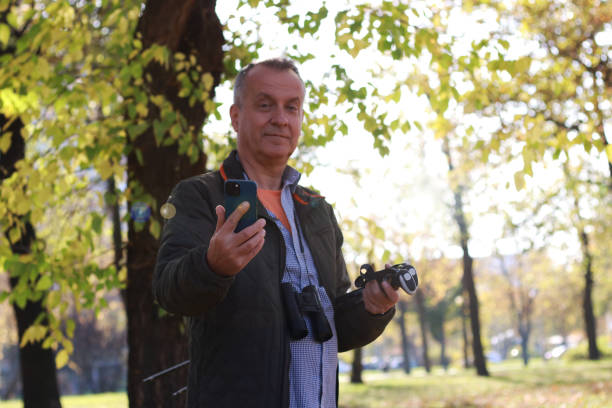 istock Mature man in adventure in nature using phone 2184428896