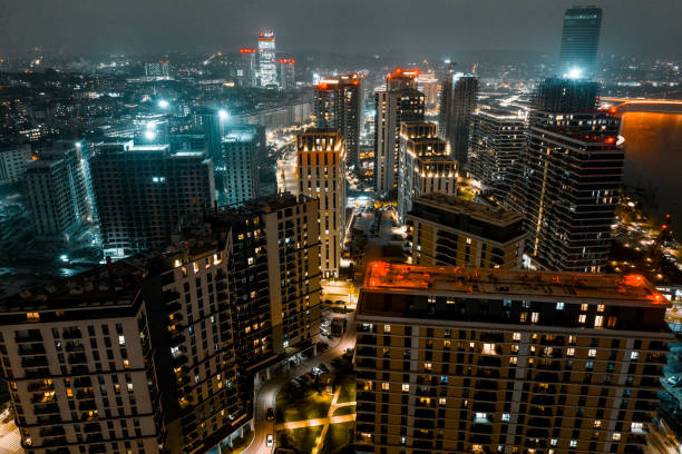Incredible scenery with modern tall buildings of the new part of Belgrade captured with a drone during the night.