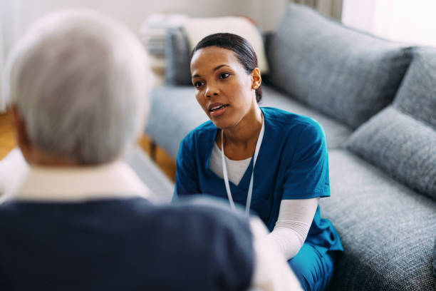 Compassionate Nurse Providing Care to Elderly Patient at Home