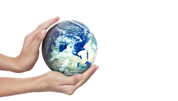 istock Globe ,earth in human hand, holding our planet glowing. Earth image provided by Nasa 2184434055