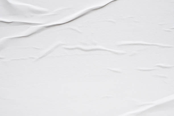 istock White blank crumpled and creased paper poster texture background 2184435276